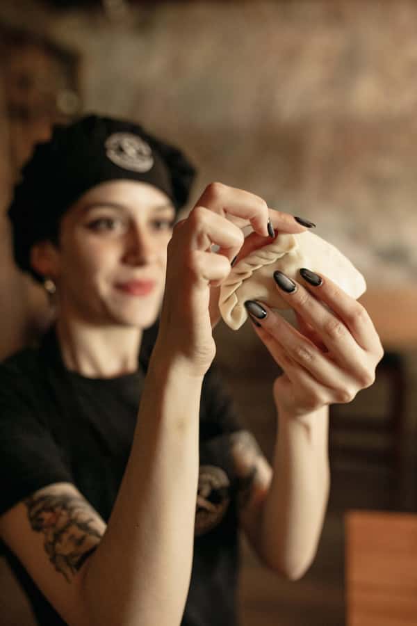 Iguazu Falls: The Argentine Experience Interactive Dinner - Folding Argentine empanadas at the communal table