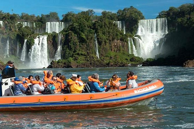 Motorboat under the waterfalls, 4x4 truck in the jungle with Argentine Falls - The 7:00 am start and the ride into the park